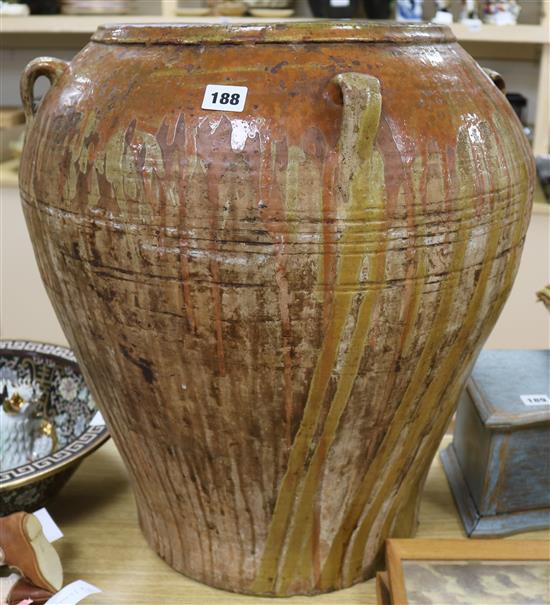 A large slip decorated terracotta vase